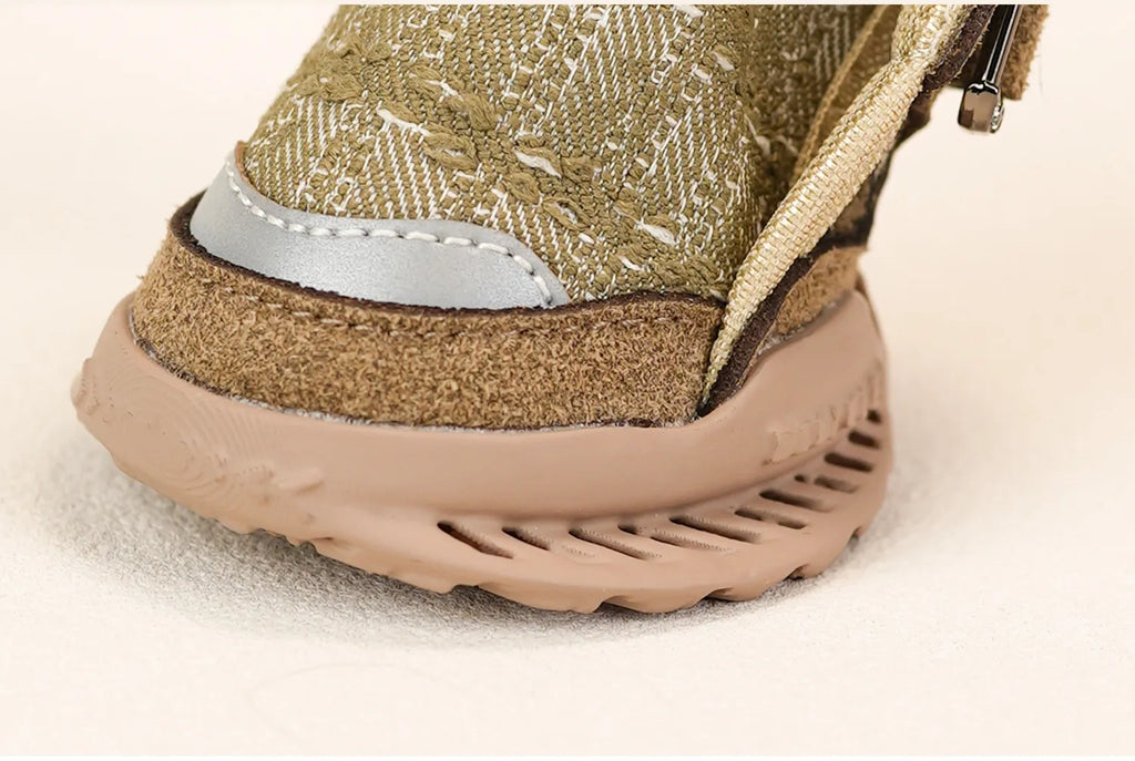 Close-up of the sandstone green dog shoe sole